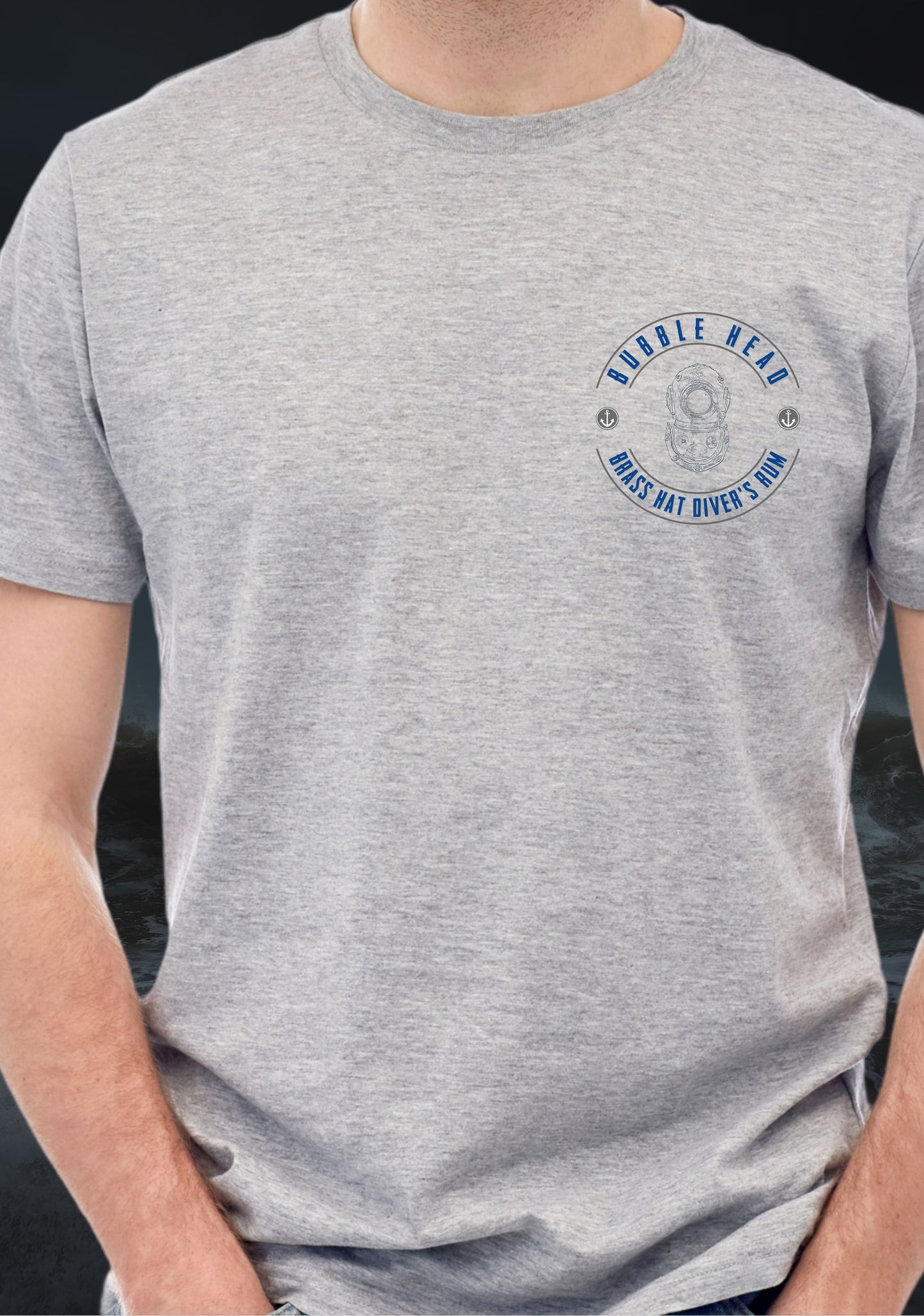 Gray t-shirt with a logo on the chest which states Brass Hat Diver's Rum and Bubble Head written in a circle with a Siebe Gorman diving helmet in the centre, against a dark background
