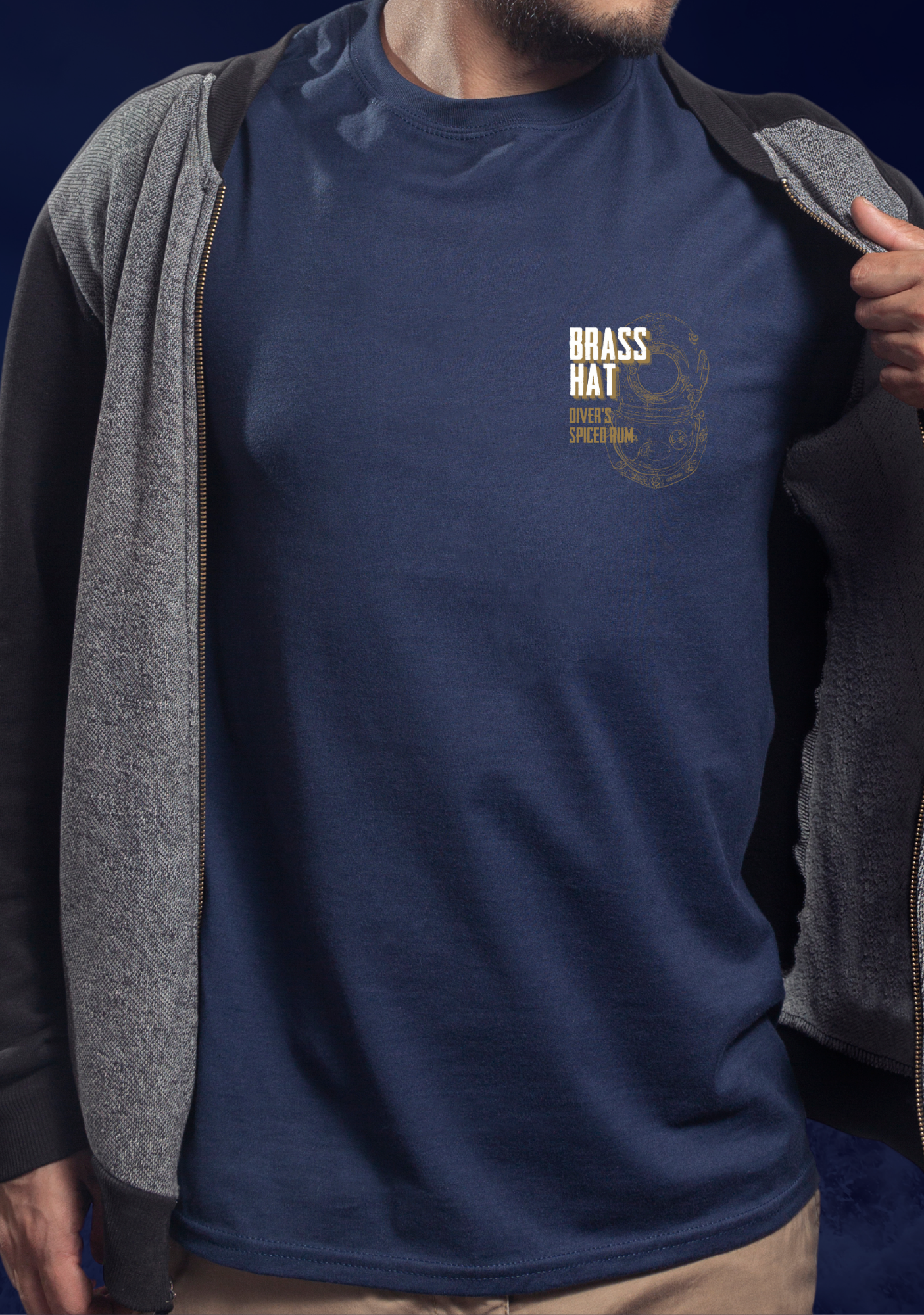 Front view of man wearing T-shirt in navy blue with deep sea diver diving helmet logo and Brass Hat Diver's Spiced Rum name