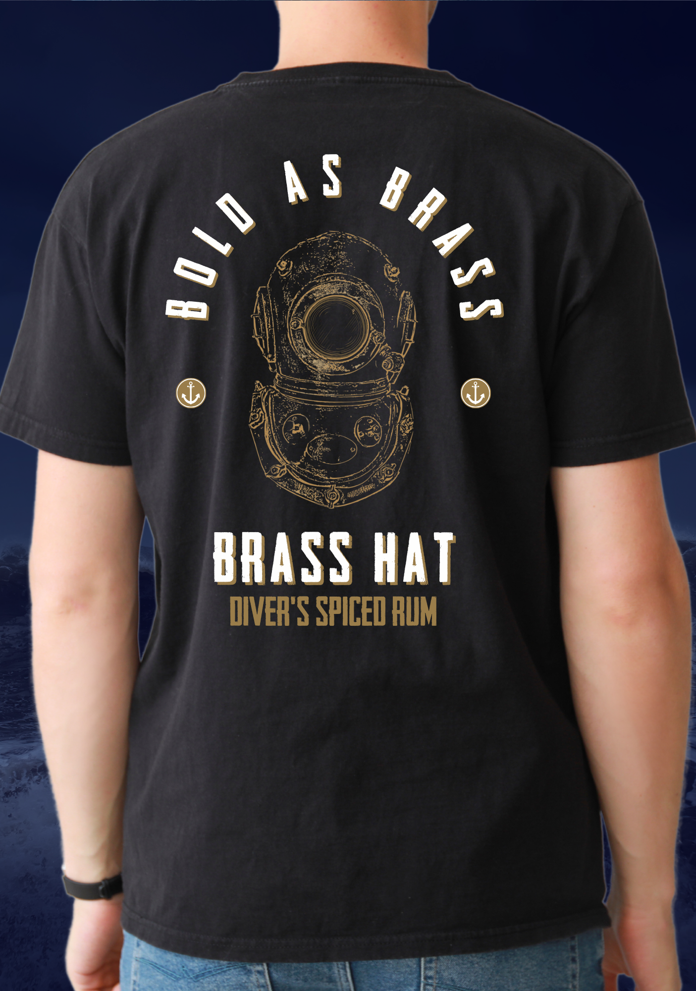 Back view of man wearing T-shirt in black Bold As Brass written on it with deep sea diver diving helmet logo anchor motifs and Brass Hat Diver's Spiced Rum name