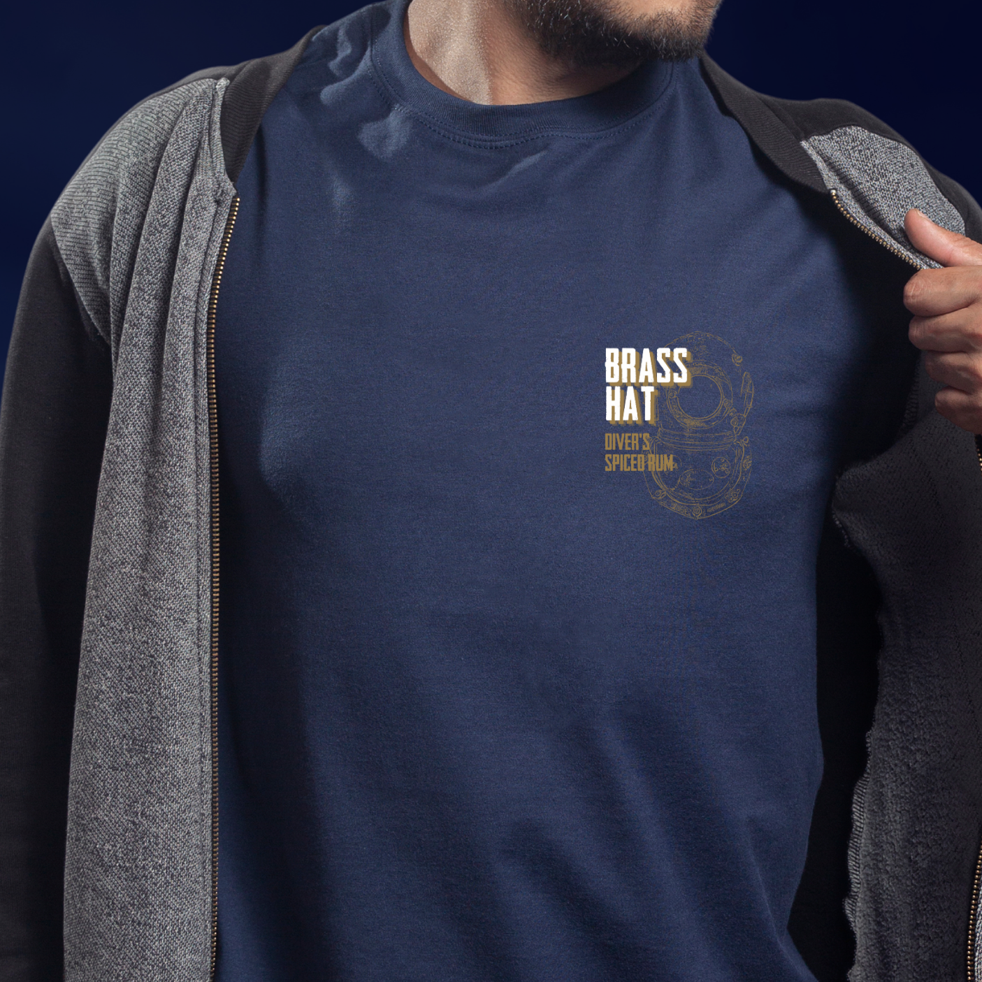 Front view of person wearing T-shirt in navy blue. Small diving helmet design Brass Hat Rum branding to left chest - divers’ gifts and ocean-inspired apparel