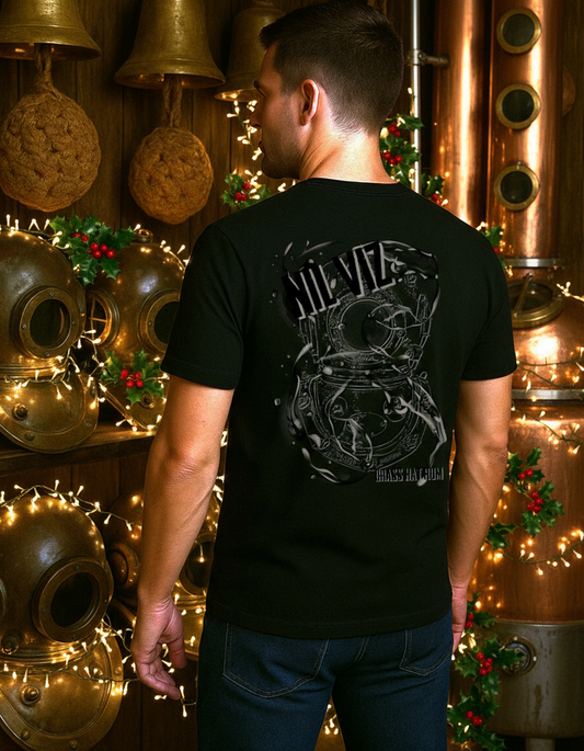 Back view of person wearing Black Nil Viz  T-shirt in a room filled with old diving equipment, Christmas decorations and a rum still. Large diving helmet design with Nil Viz branding . - divers’ Christmas gifts and ocean-inspired apparel