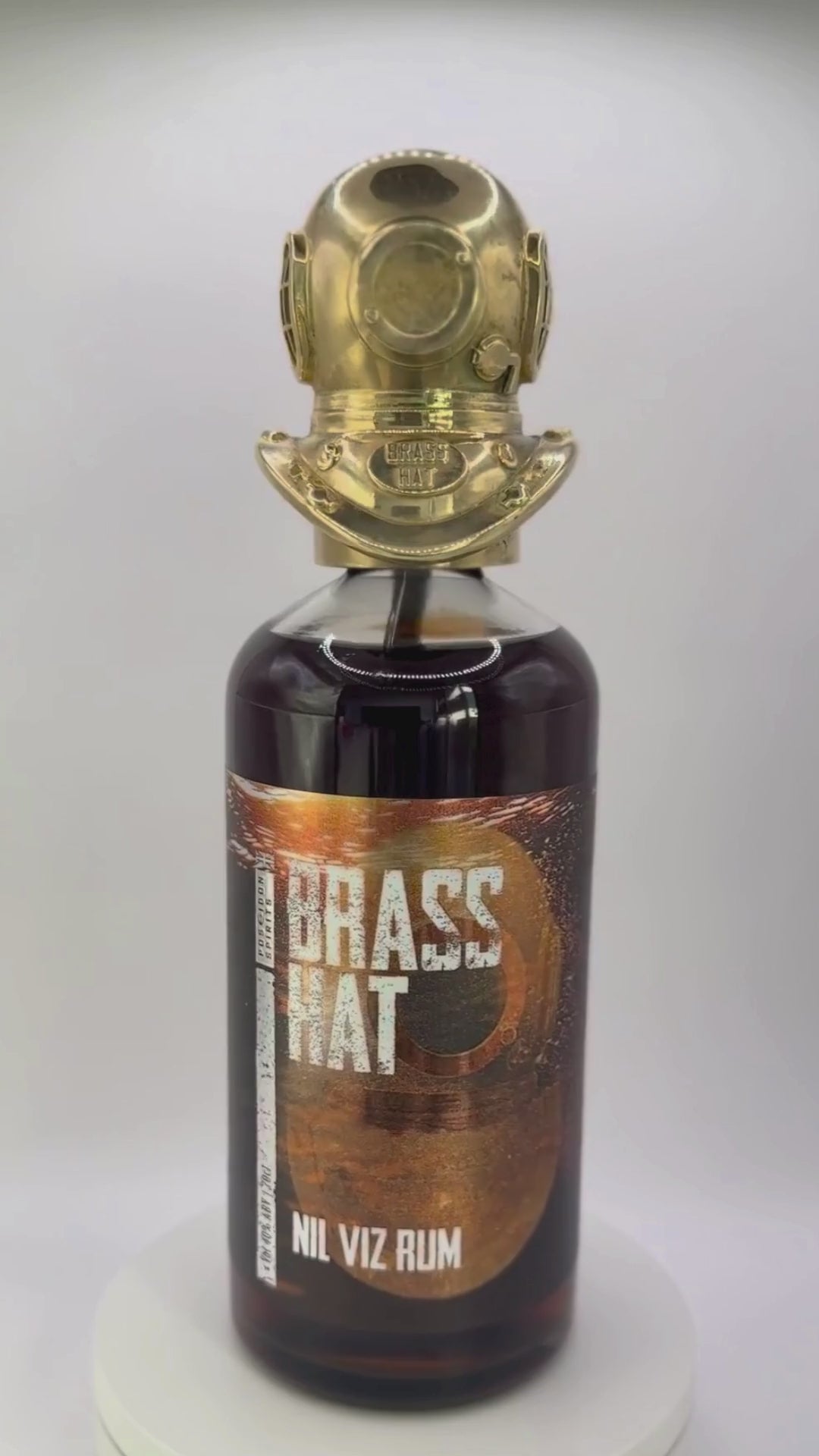 Showcase video of Brass Hat Diver's Helmet Bottle Topper rotating on a bottle of Brass Hat Nil Viz Rum. Perfect Diver's Gift