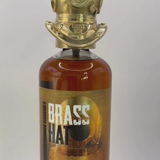 Showcase video of Brass Hat Diver's Helmet Bottle Topper rotating on a bottle of Brass Hat Diver's Spiced Rum. Perfect Diver's Gift
