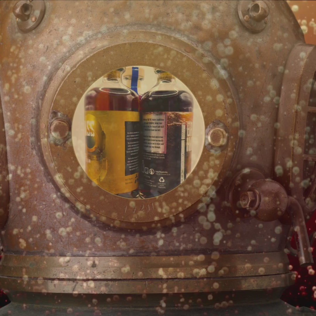 Rotating video of three Brass Hat Diver’s Rum bottles viewed through the face window of a vintage diving helmet underwater, showcasing premium small-batch rum and ideal for gifting or event display